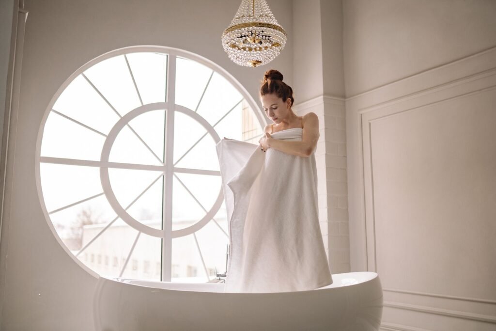 Woman wrapped in a large bath sheet