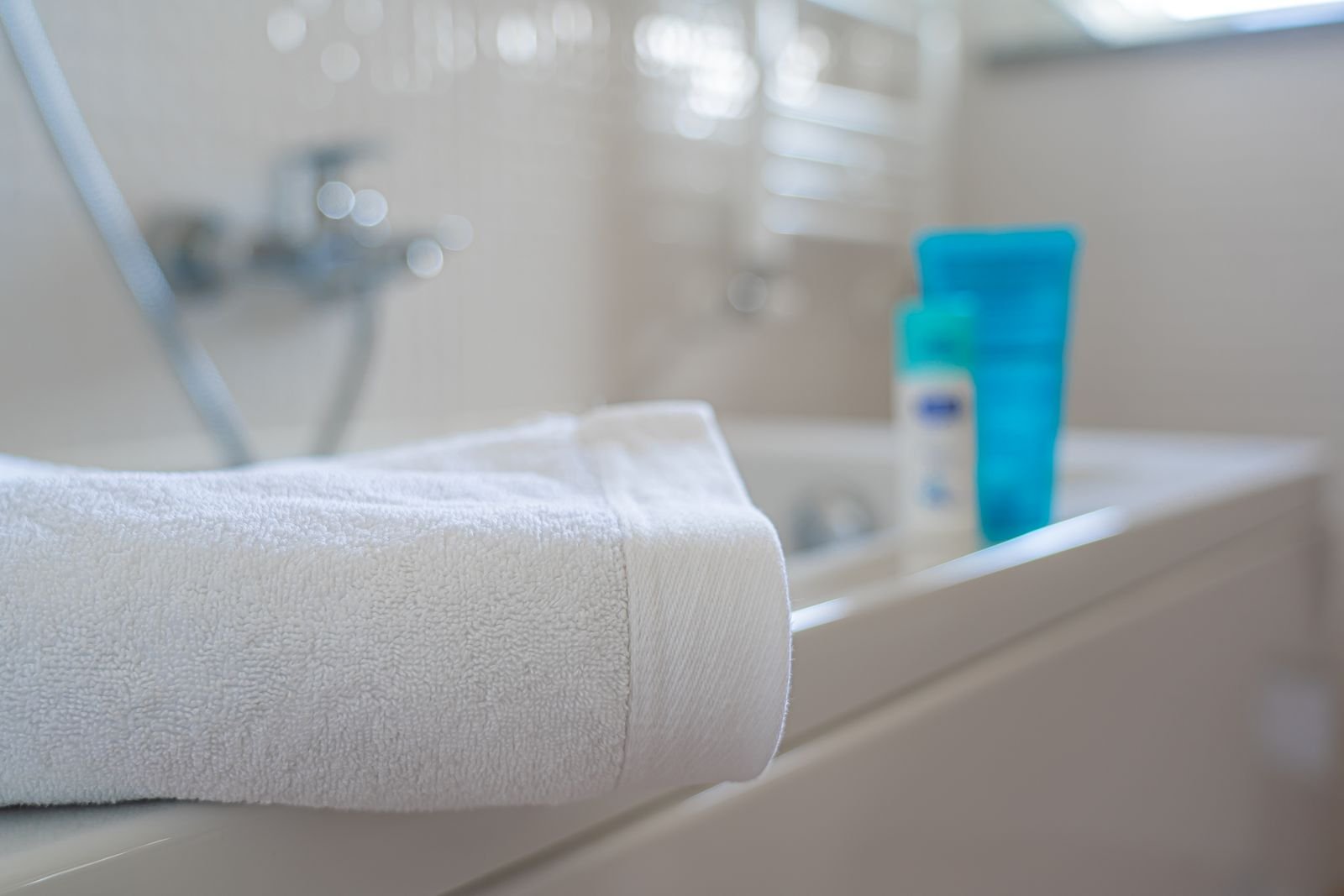Neatly folded white bath towel