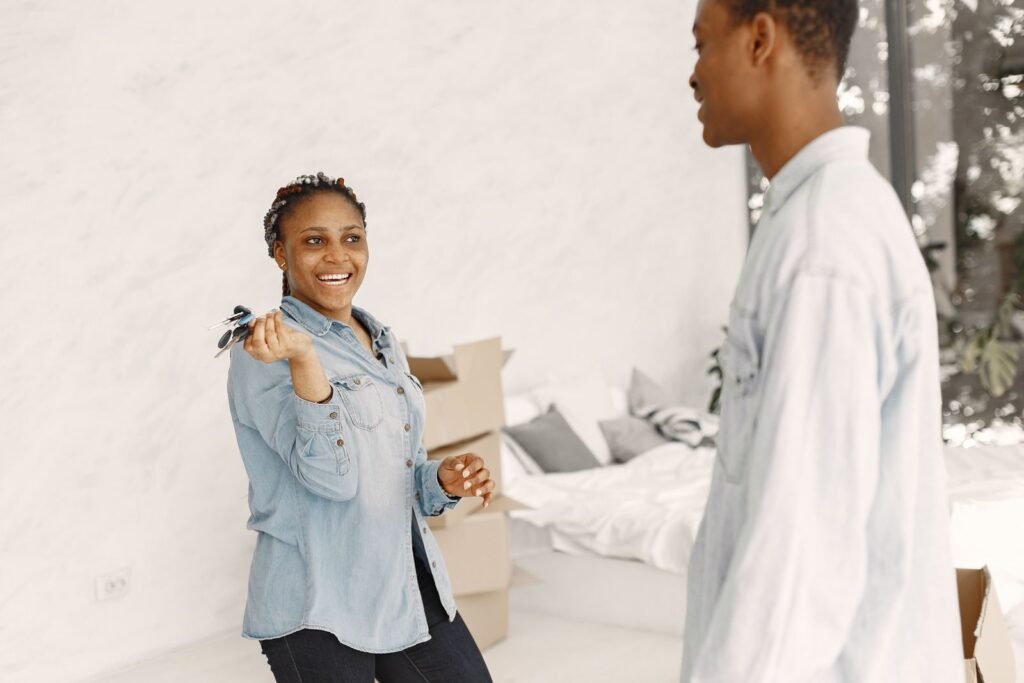 Couple holding keys to their new home