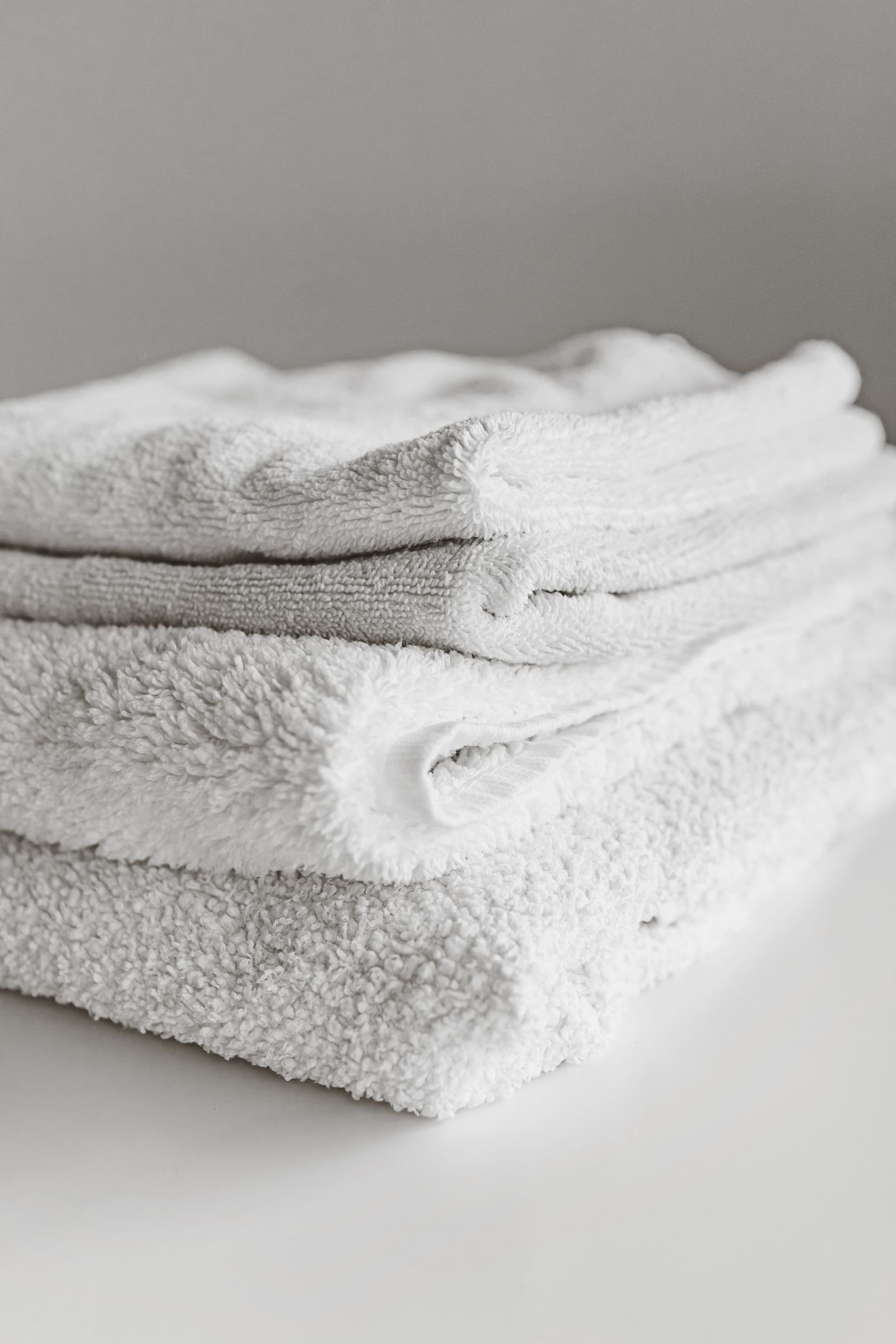 Neatly folded white spa towels